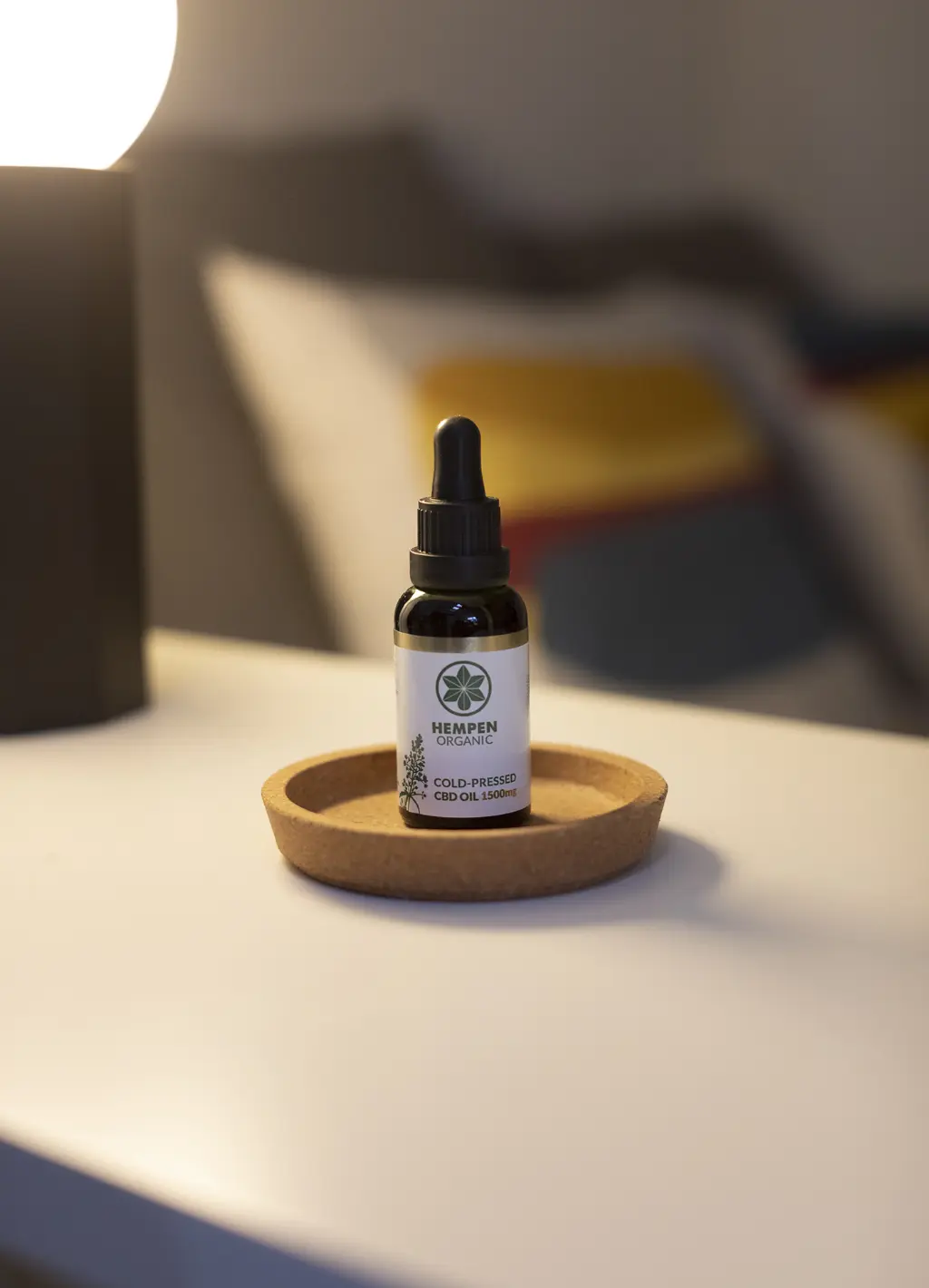 CBD Cold Pressed 1500mg on bedside table in wooden dish